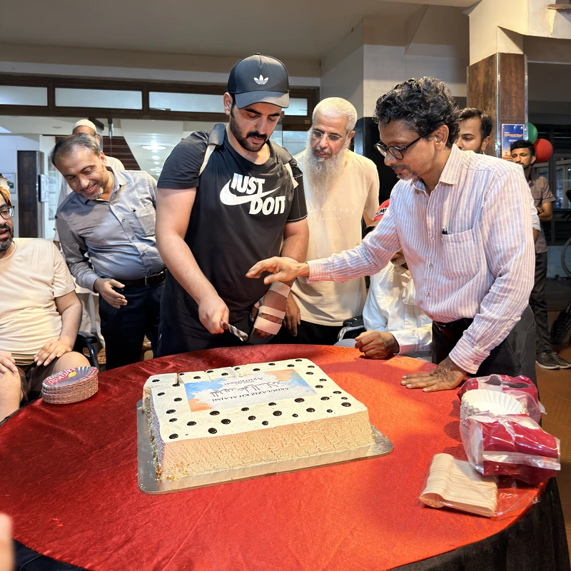 Rehabilitation milestone celebration and cake cutting with medical team